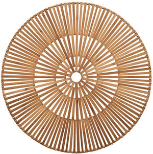 The Kim Seybert Spoke Placemat is a round, flat white bamboo piece featuring organic elements and a radial geometric pattern with a small center hole.