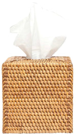 The Dalton Bath Collection by Pigeon & Poodle features a square, handmade rattan tissue box holder with detailed craftsmanship and a white tissue elegantly protruding from the top.