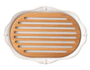 The Juliska Berry & Thread Classic Whitewash Challah Board features an elegant white base and a removable slotted wooden insert, blending decorative style with practical design.