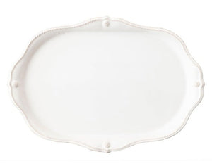The Juliska Berry & Thread Classic Whitewash Challah Board features an oval ceramic design with a scalloped, rope-patterned edge—ideal as a challah board or serving platter for elegant table settings.