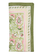 The Mira Napkin Set by Kim Seybert features folded linen napkins with a green, pink, and white floral and geometric paisley pattern, finished with a green border.