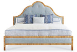 The Sloane King Bed by Mr & Mrs Howard features a light wood frame, blue upholstered headboard, and three blue and white decorative pillows on crisp white bedding.