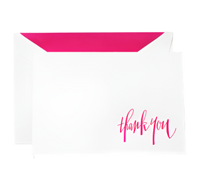 The Crane Raspberry Thank You Note Card Set by Crane features a white card with "thank you" in raspberry calligraphy, accompanied by a pink-lined matching envelope, delivering artistic stationery elegance.
