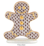 From the Herend Gingerbread Man Collection, this ceramic figurine features a brown and white patterned body, gold accents, a hand-painted smile, and "Chocolate" labeled at the base.