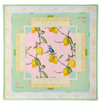 The Oh My Mahjong Mahjong Mat Collection silk square scarf features lemons and a bird on branches at the center, bordered by Capri-inspired pastel green and yellow geometric patterns with labeled sections referencing mahjong tiles.