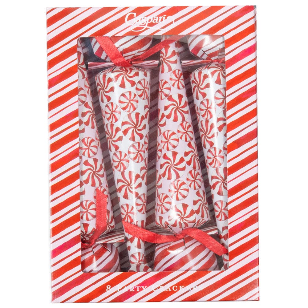 A box of eight Caspari Peppermint Crackers with red and white swirl designs and red ribbons, displayed in striped packaging with a clear window—festive surprises ideal for your next celebration.