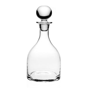 The William Yeoward Crystal Classic Decanter features clear glass and a round stopper, ideal for serving wine or spirits, shown against a white background.