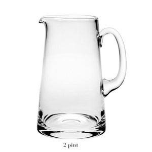 The Classic Pitcher Collection by William Yeoward Crystal features a clear glass pitcher with handle, labeled "2 pint"—ideal for serving water or fruit juice.