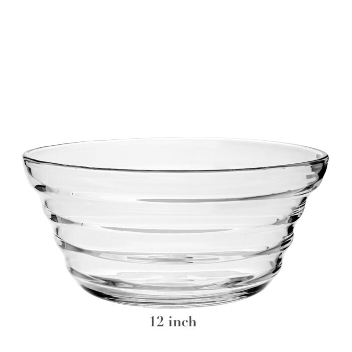 The Ripples Serveware Collection by William Yeoward Crystal features a clear glass bowl with horizontal ridges and a 12-inch diameter, shown on a white background for an artisanal touch.