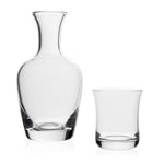 The William Yeoward Crystal Carafe and Tumbler Set, handmade from clear crystal, is perfect for your bedside table and displayed against a white background.