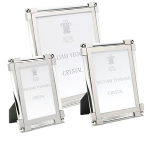 Three frames from the Clear Classic Frame Collection by William Yeoward Crystal, crafted with silver-toned glass and nickel-plated edges in varied sizes, display placeholders reading "William Yeoward Crystal.