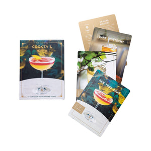 The Essential Cocktail Deck by Penguin Random House includes a box and four displayed recipe cards, each featuring detailed cocktail recipes perfect for any enthusiast.