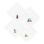 The Duggan Society Cocktail Napkin Collection features four white cotton cocktail napkins, each with a unique hand-embroidered golf-themed design: a golf bag, cart, ball on tee, and putting green with flag.