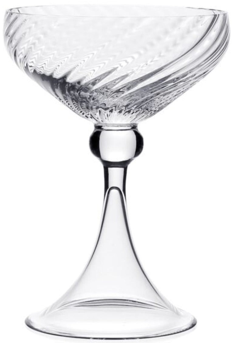 The Venetia Drinkware Collection by William Yeoward Crystal features a clear coupe with a textured bowl, elegant stem, and wide base, beautifully photographed against a plain white background.