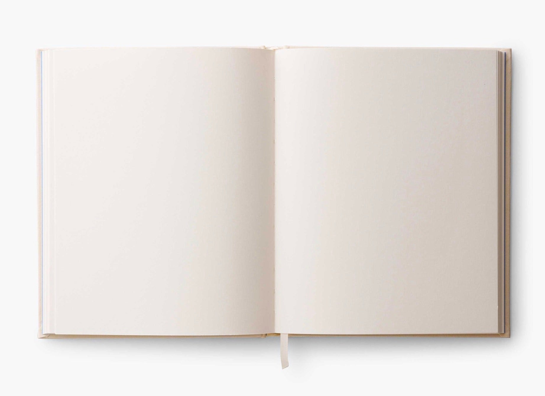 An open blank book from the Curio Desk Accessory Collection by Riffle Paper Co., featuring cream pages and a ribbon bookmark—ideal for garden lovers to sketch bugs or record discoveries.