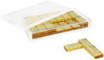 A Tizo Design Lucite Domino Set Collection containing multiple slots with yellowish-brown dominoes, some of which are visible through the clear lid, with two individual dominoes lying in front outside the case, perfect