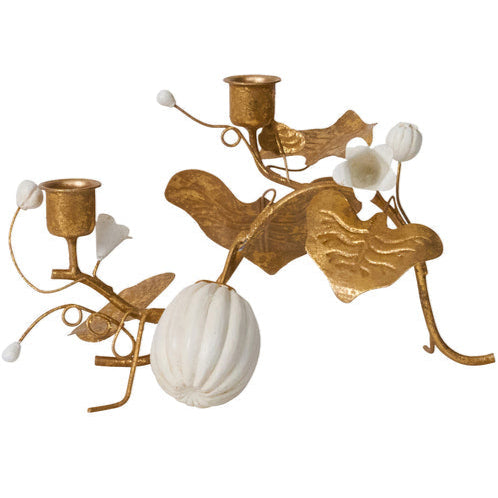The Juliska Forest Walk Tabletop Collection features two gold metal candle holders with sculpted leaves, white buds, and a white pumpkin accent—an elegant display perfect for your table, napkin rings, or place card holders. Shown on a white background.