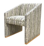 A Dune Dining Chair by Vanguard featuring straight, angular lines and a green and white DaDa Stripe Cactus fabric with wooden legs.