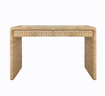 The Adrien Desk by Worlds Away is a rectangular woven rattan desk with two front drawers and brass ring handles, offering a natural texture and minimalist design—ideal for an elegant workspace.