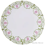 A round white fine bone china dinner plate from the Cobblers Cove Camelot Dinnerware Collection by Royal Crown Derby, featuring a green vine and pink flower rim. Labeled "Dinner Plate - White Leaf." Ideal for luxury boutique hotels.