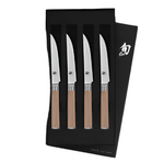 The Shun Classic Blonde Steak Knife Set, 4-Piece, features four razor-sharp knives with VG-MAX cutting cores and blonde wood handles, elegantly presented in a black box.