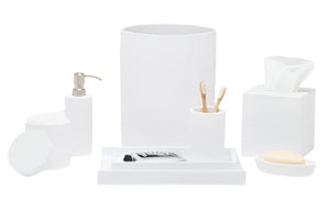 From the Dover Bath Collection by Pigeon & Poodle, this set offers white engraved resin accessories—soap dispenser, toothbrush holder, tissue box, tray, soap dish, jar, and waste bin—displayed on a white backdrop.