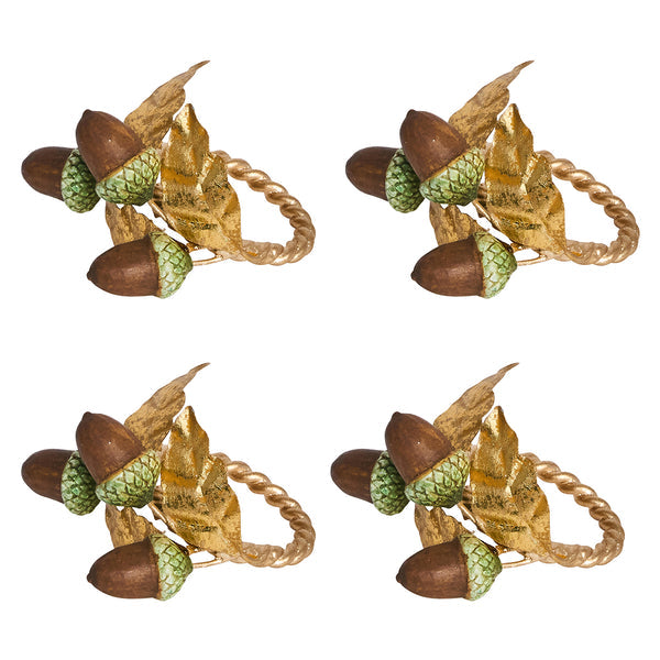 Juliska's Forest Walk Tabletop Collection features four gold napkin rings with brown acorns, green caps, and gold oak leaves—ideal as napkin rings or as charming oak leaf decor for your table.