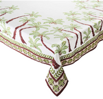 Bring tropical charm to your table with the Kim Seybert Oasis Tablecloth, featuring green palm trees with brown trunks and a coordinating geometric green and brown border.