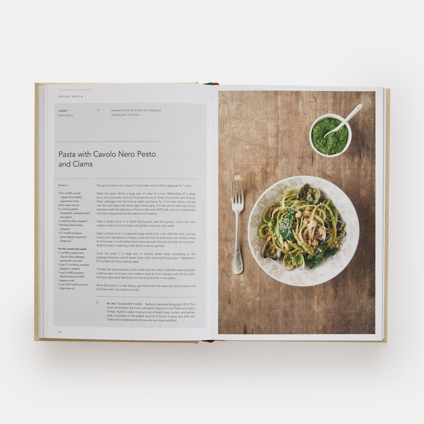 An open copy of "Eataly: Contemporary Italian Cooking" by Phaidon showcases a delightful recipe for "Pasta with Cavolo Nero Pesto and Clams" on the left page, while the right features an enticing image of the dish alongside a fork. Ideal for those seeking recipes that embody the essence of Italian home cooking.