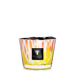 A colorful Baobab Collection Eden Garden candle with a flame-like design on the glass container, set against a plain white background.