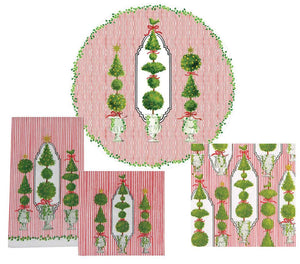 The Eloise Napkin and Placemat Collection by Caspari features Christmas-themed linens with red stripes, green topiary trees, wreaths, and bows in round and rectangular shapes. These triple-ply napkins boast festive German-printed designs.