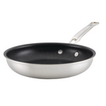The Hestan Thomas Keller Commercial Clad Stainless Steel TITUM® Nonstick Sauté Pan, 12.5", features a black diamond-infused nonstick interior and metal handle, displayed against a white background.