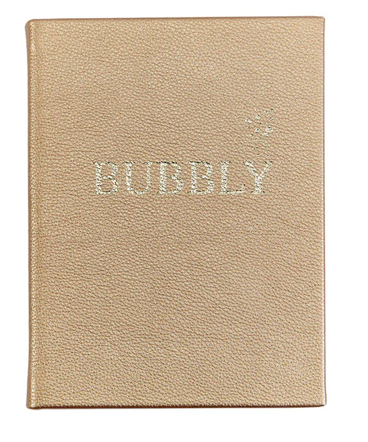 The "Bubbly" notebook by Graphic Image features a gold textured cover with "BUBBLY" in sparkly letters—ideal for recording your favorite champagne cocktail and festive drink recipes.