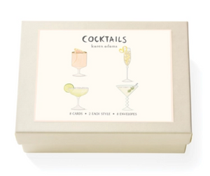 The Cocktails Card Set by Karen Adams comes in a cream-colored box decorated with four cocktail illustrations and includes 8 hand-embellished, natural white note cards (2 of each style) with matching envelopes—ideal as a hostess gift.
