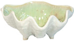 From AE Ceramics’ Small Clam Bowl Collection, this ceramic nut bowl features a wavy, textured white exterior and a glossy pale green interior, inspired by natural clam shells.