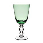 A hand-blown wine glass from the William Yeoward Crystal Apple Green Fanny Collection, featuring a wide bowl and ornate clear stem, photographed on a white background.