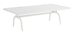 The Haret Outdoor Cocktail Table by Hickory Chair is a rectangular white cast aluminum table with a lattice-patterned top and four curved legs.