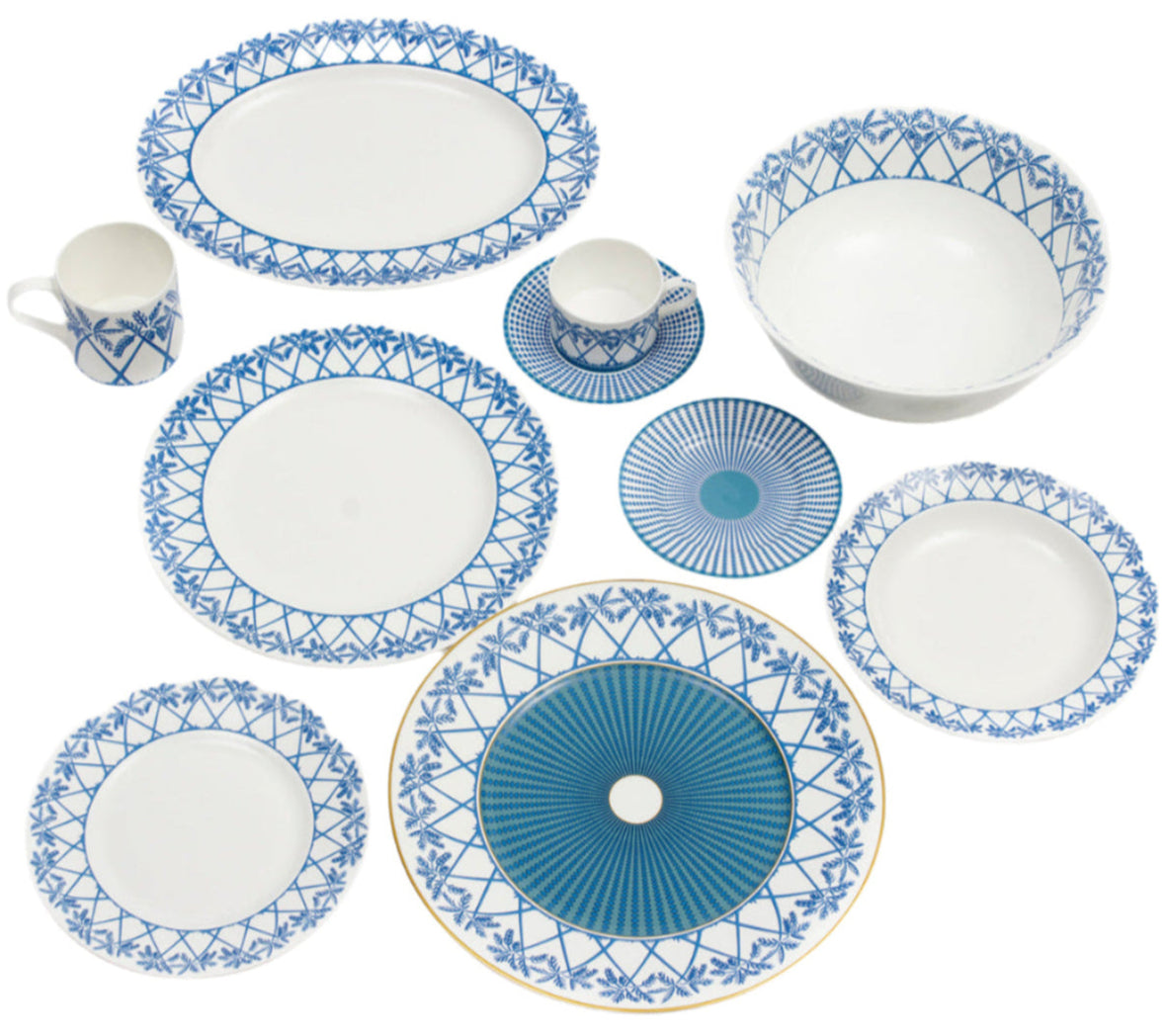 The Pink House Mustique Azure Blue Dinnerware Collection features custom ceramic plates, bowls, and mugs with blue geometric and floral patterns, beautifully arranged on a white background.