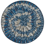 The Kim Seybert Illusion Placemat is a circular design adorned with blue, silver, and white beads and sequins in an abstract spiral pattern.
