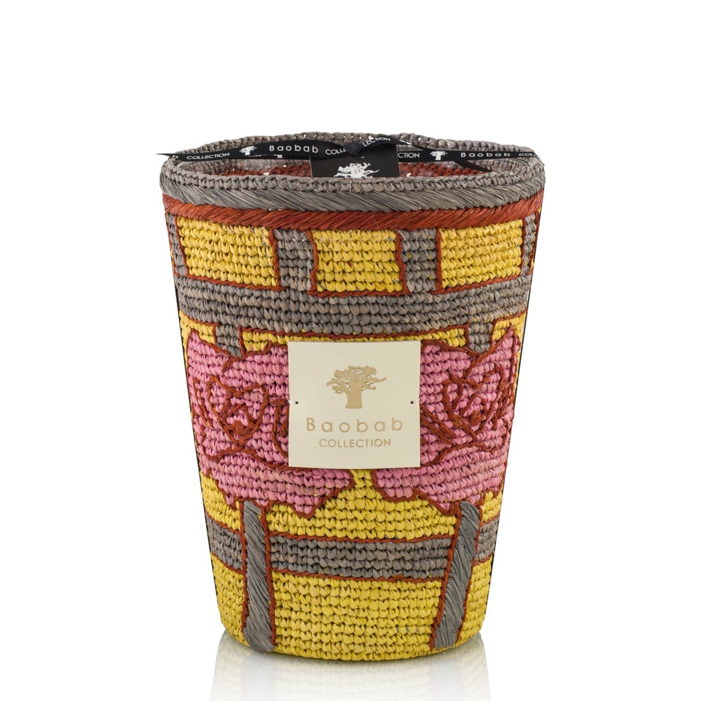 Woven multicolored scented Baobab Frida Draozy Magda Candle Collection with branded label.