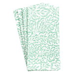 Handcrafted from cotton, Caspari’s Block Print Leaves Napkin Collection features a green leafy pattern on white, celebrating the elegance of Indian textiles.