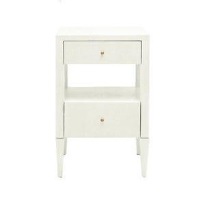 The Conrad Nightstand Collection by Made Goods features wood drawers, a central open shelf, small round gold knobs, and elegant faux raffia wrapping.