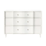 The Essery Dresser Collection by Made Goods features a white three-drawer dresser with a curved front middle section, six round knobs, soft-close glides, and four short legs.