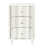 The Essery Nightstand from Made Goods features three white drawers with silver knobs, faux raffia textures, black outlining, and four angled legs—a stylish transitional piece for any room.