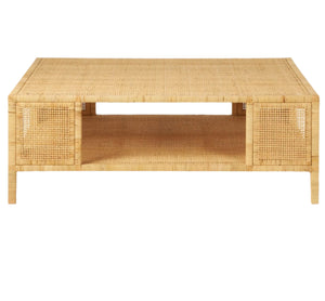 The Isla Coffee Table by Made Goods is a rectangular rattan piece with a lower shelf and two woven side panels, shown against a white background.
