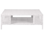 The Isla Coffee Table by Made Goods features a rectangular white rattan design with an open lower shelf, displayed against a plain white background.
