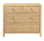 The Isla Dresser Collection by Made Goods features a natural woven rattan dresser with four soft-close drawers and flower-patterned brass knobs, shown against a white background.