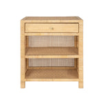 The Isla Nightstand Collection by Made Goods features a rectangular rattan frame, woven cane sides and back, a soft-close top drawer, and two open shelves.