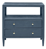 The Jarin Nightstand by Made Goods is a dark blue wooden piece with two European-glide drawers, gold knobs, and an open shelf above, highlighting quality craftsmanship.