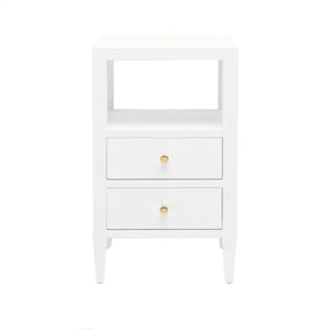 The Jarin Nightstand Collection by Made Goods features a white linen finish, two drawers with round gold knobs, European glides for smooth use, and an open shelf above—all beautifully presented against a plain white background.
